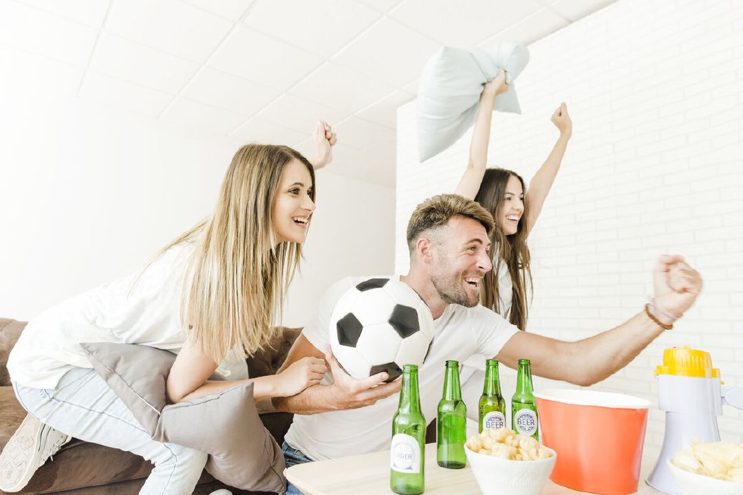 images/friends-celebrating-watching-football-home.jpg